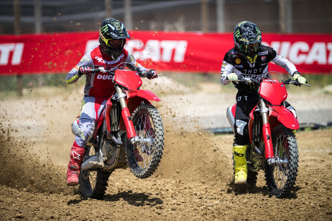 Ducati riders accelerating side by side